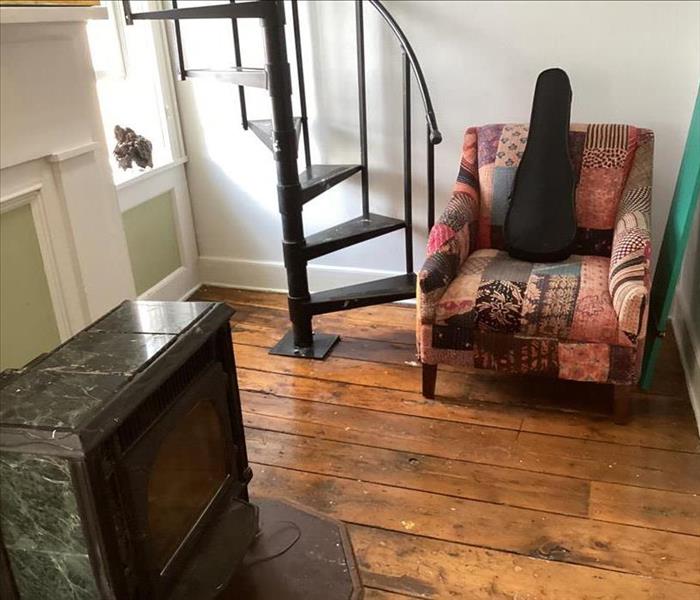 Stairwell, flooring, upholstery, and fireplace free of fire extinguisher debris